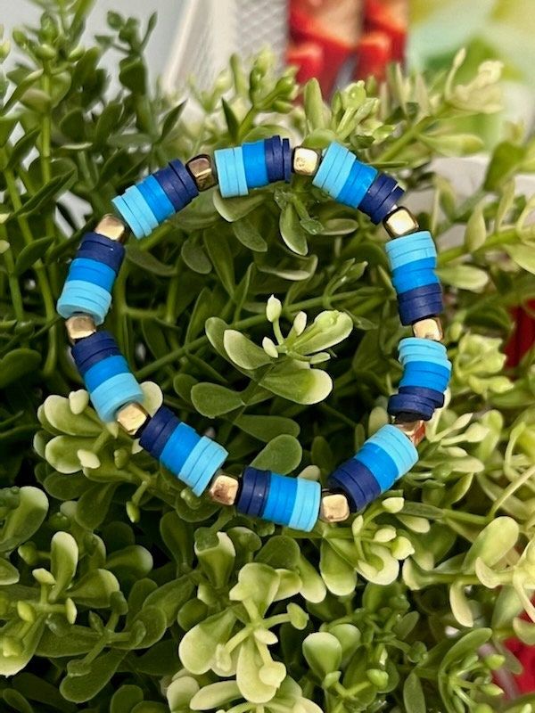 This is a Blue Clay Beaded Bracelet.  Comes with 1 surprise! <3 Blue Stretch Bracelet With Colorful Beads For Vacation, Casual Blue Hand-strung Bracelets, Blue Round Bead Bracelets For Vacation, Blue Round Beads Bracelets For Vacation, Blue Round Beads Friendship Bracelets For Vacation, Blue Bracelets With Round Beads For Vacation, Blue Friendship Bracelets With Round Beads For Vacation, Blue Friendship Bracelets With Colorful Beads For Vacation, Casual Blue Beaded Bracelet With Large Beads