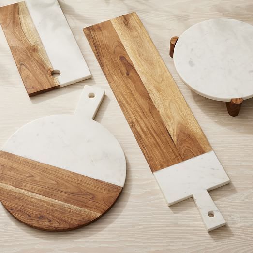 three pieces of wood and marble sitting on top of a table