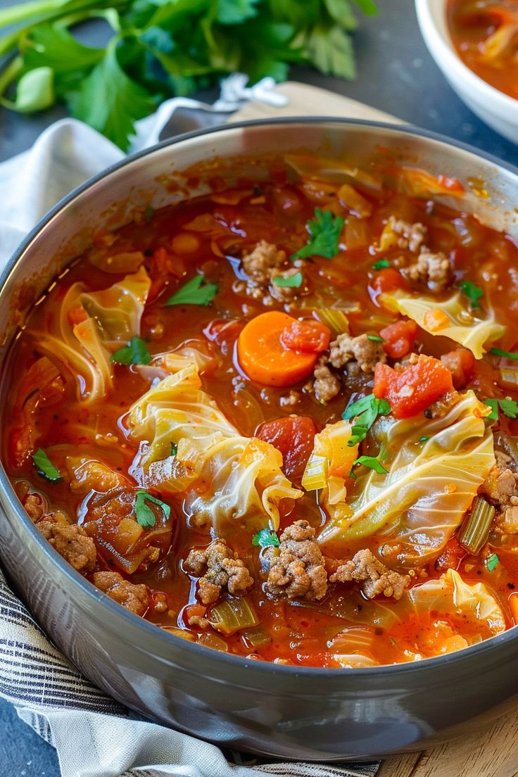 a large pot filled with cabbage and meat soup