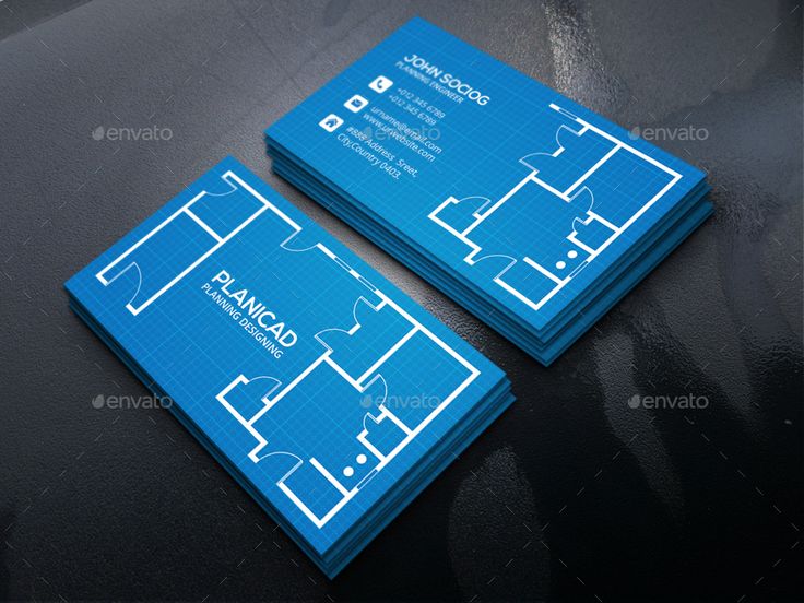 two blue business cards sitting on top of a black table next to eachother