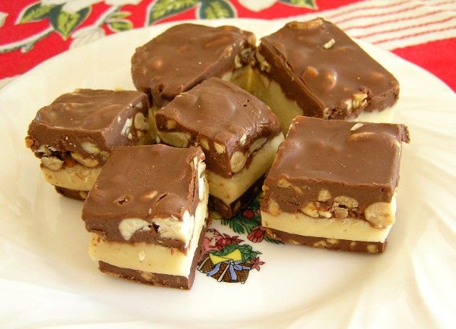 several pieces of chocolate and nuts on a plate