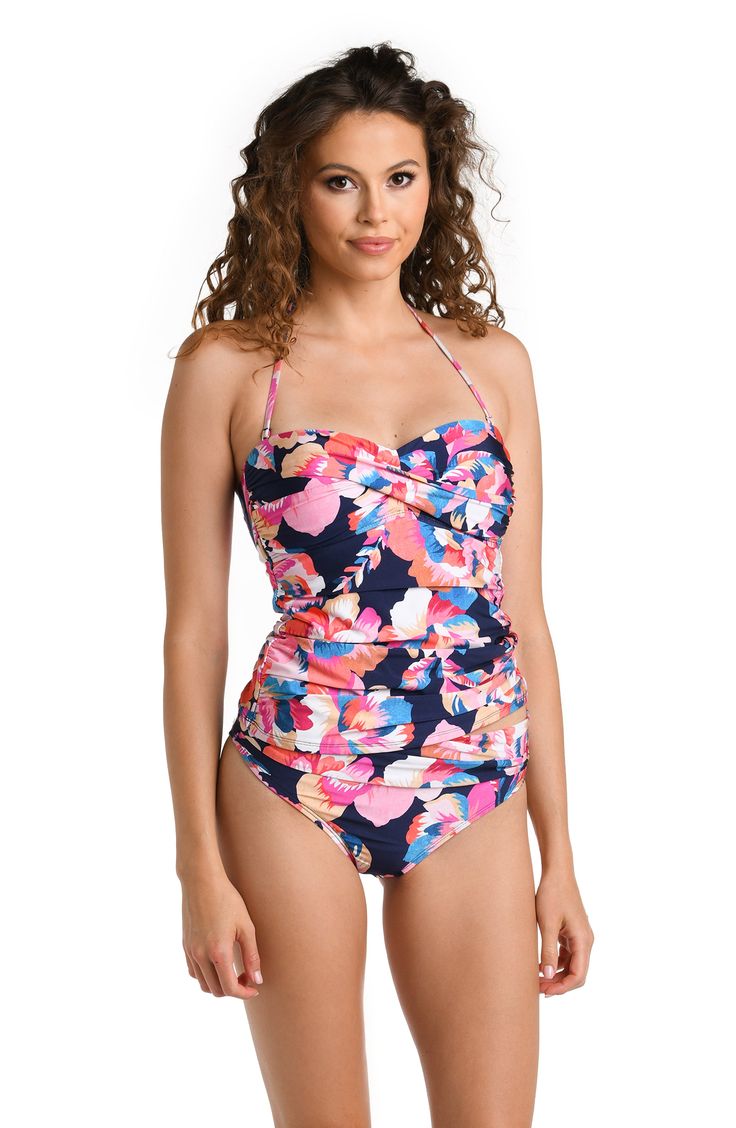 Model is wearing a multicolored Bandeau Tankini Swimsuit Top Summer Strapless Swimwear With Floral Print, Strapless Floral Print Swimwear For Sunbathing, Strapless Floral Print Swimwear For Beach Party, Strapless Floral Print Swimwear For Vacation, Pink Tropical Swimwear With Vibrant Print, Tropical Pink Swimwear With Vibrant Print, Pink Vibrant Print Swimwear For Poolside, Pink Swimwear With Vibrant Print For Poolside, Fitted Floral Print Tankini For Pool