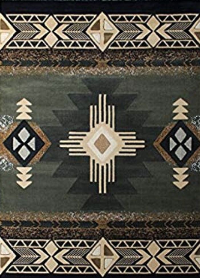 an area rug with geometric designs on the front and back, in various shades of green