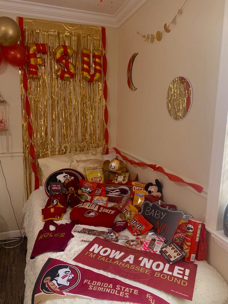 a bed room with a neatly made bed and decorations on the wall above it that says now a nole