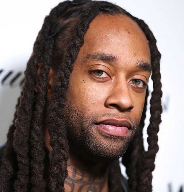 a close up of a person with dreadlocks