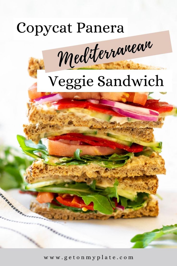 a stack of veggie sandwiches with text overlay that reads copycat panera mediterranean veggie sandwich