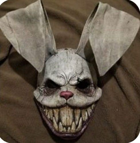 a creepy mask with an evil look on it