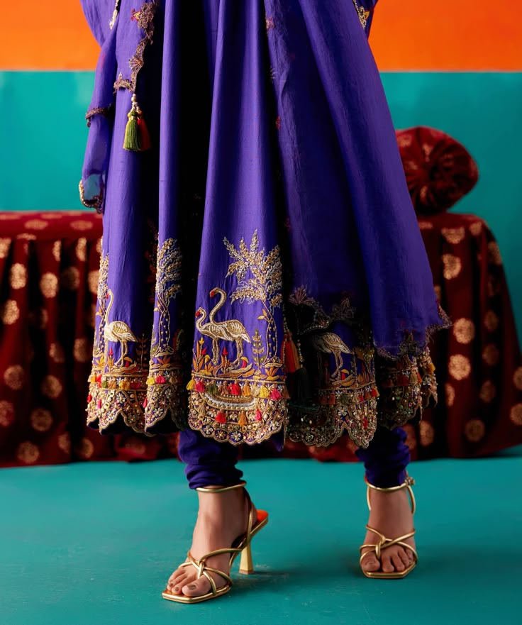 Dress in timeless grace with this purple anarkali set, featuring flora and fauna embroidery adorned with various embellishments for added allure. Paired seamlessly with complementing pants and an embroidered dupatta, this ensemble exudes sophistication and intricate detailing. Anarkali Kurti Design, Purple Anarkali, Anarkali Designs, Lehenga Saree Design, Anarkali Kurtis, Indian Outfits Lehenga, Embroidered Anarkali, Designer Kurti Patterns, Kurti Embroidery Design