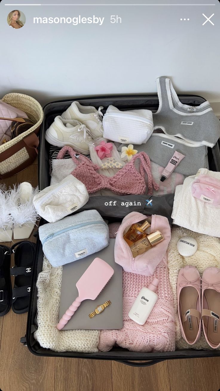 an open suitcase filled with clothes and shoes