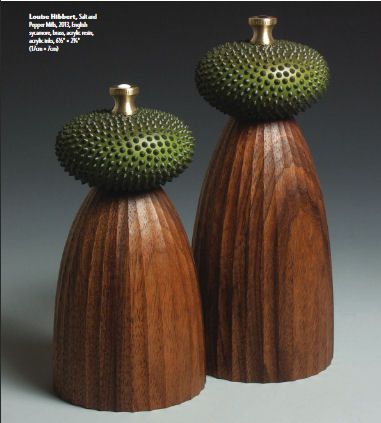 two wooden vases sitting on top of each other