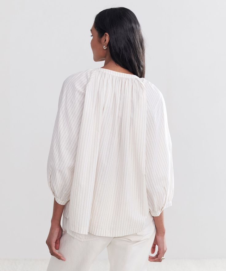 Willow Blouse Putty Stripe Equally relaxed and elegant, this essential is suited for an array of seasonal outings. Wear it tucked in for a boxy style moment or untucked for an effortlessly floaty silhouette. 88% cotton, 12% linen. Made in China. Lightweight blouse with a slightly boxy fit. | Jenni Kayne Women's Willow Blouse Size Small Relaxed Fit Tops With Blouson Sleeves For Day Out, Classic Spring Blouse For Casual Gatherings, Classic Blouse For Spring Casual Gatherings, Classic Blouse For Casual Spring Gatherings, Versatile Daywear Blouse With Relaxed Fit, Classic Blouse With Blouson Sleeves Relaxed Fit, Versatile Relaxed Fit Blouse For Daywear, Classic Blouse With Blouson Sleeves And Relaxed Fit, Classic Blouse With Blouson Sleeves