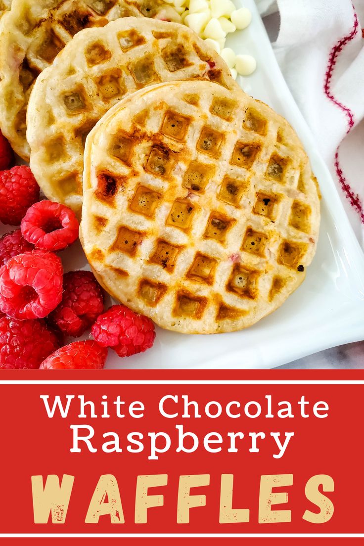 white chocolate raspberry waffles on a plate with raspberries