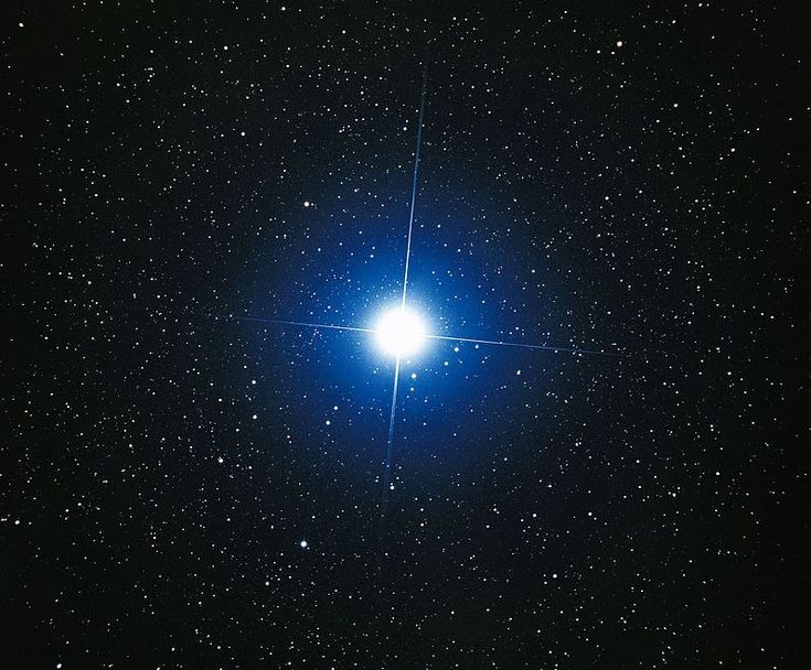 the bright blue star is shining brightly in the dark sky