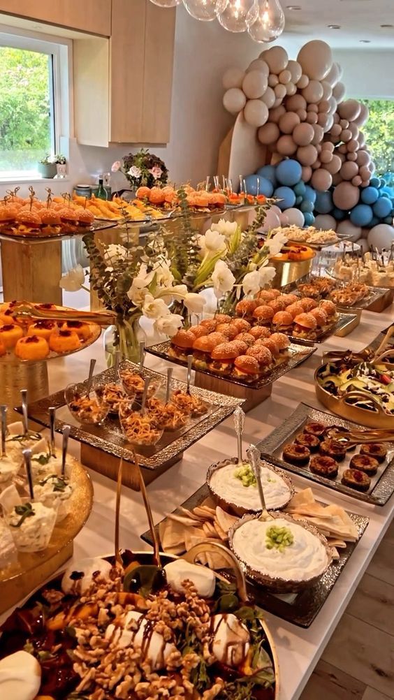 a buffet table filled with lots of food