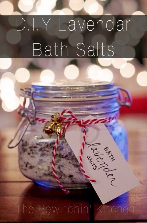 a jar filled with bath salts sitting on top of a wooden table