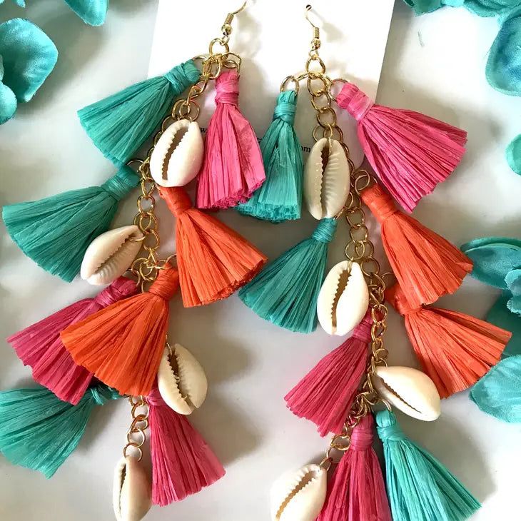 Make a big splash with our multi-color raffia tassel earrings! 🎉 Featuring effortlessly elegant, sleek cowrie shells and vibrant boho-chic tassels, these statement makers are the ultimate beach vibe upgrade. Rock the beachy vibes and turn heads with our multi-color version! 🌈 Let these fabulously chic beachy statement makers tassels sway down to on your shoulders! They're extra-long, pure luxe, lightweight and comfortable.🌴 Features Material: Cowrie Shell and Raffia Drop length: 6.5 inches; w Trendy Summer Festival Tassel Earrings, Summer Festival Trendy Tassel Earrings, Vibrant Beach Earrings, Chic Dangle Jewelry For Beach, Chic Dangle Jewelry For The Beach, Chic Summer Dangle Tassel Earrings, Chic Summer Jewelry With Tassels, Chic Tassel Earrings For Summer, Multicolor Fringe Tassel Earrings For The Beach