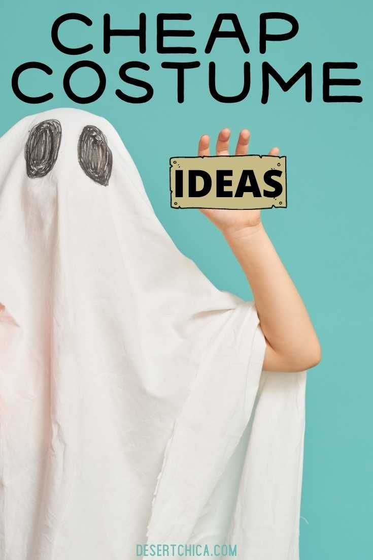 a person in a ghost costume holding up a sign with the words cheap costume on it