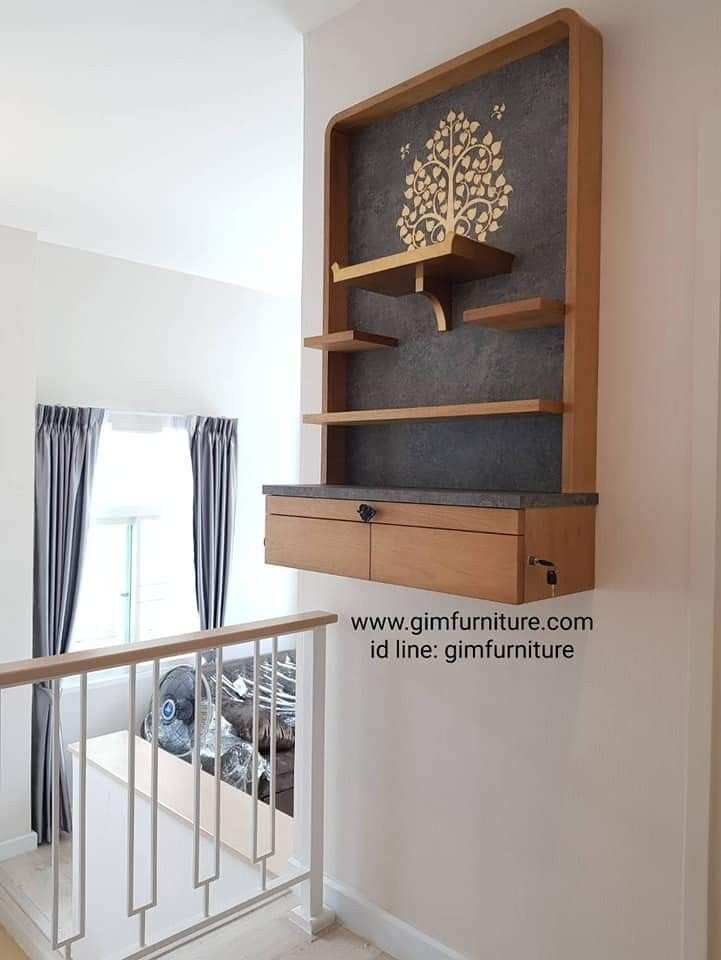 a wooden shelf sitting on the side of a white wall next to a metal banister