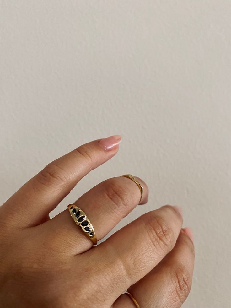 Can you see the crown again in this dark beauty of a signet ring? The Dark Gaea features marquise and round conflict-free black diamonds measuring 1.2mm - 3.5mm. The solid gold signet ring is 5mm wide, tapers to 1.25mm and is approximately 1mm thick. Find us diamond babes w Anastassia Sel at our boutique. Minimalist Black Diamond Promise Ring, Classic Black Spinel Promise Ring, Black Fine Jewelry Rings For Everyday, Everyday Black Fine Jewelry Ring, Everyday Fine Black Ring, Classic Jewelry Ring With Black Diamonds, Classic Yellow Gold Rings With Black Diamonds, Classic Black Spinel Ring, Gold Rings With Black Diamonds For Wedding