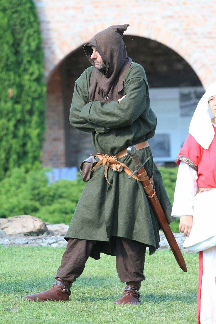 two people dressed up in medieval costumes