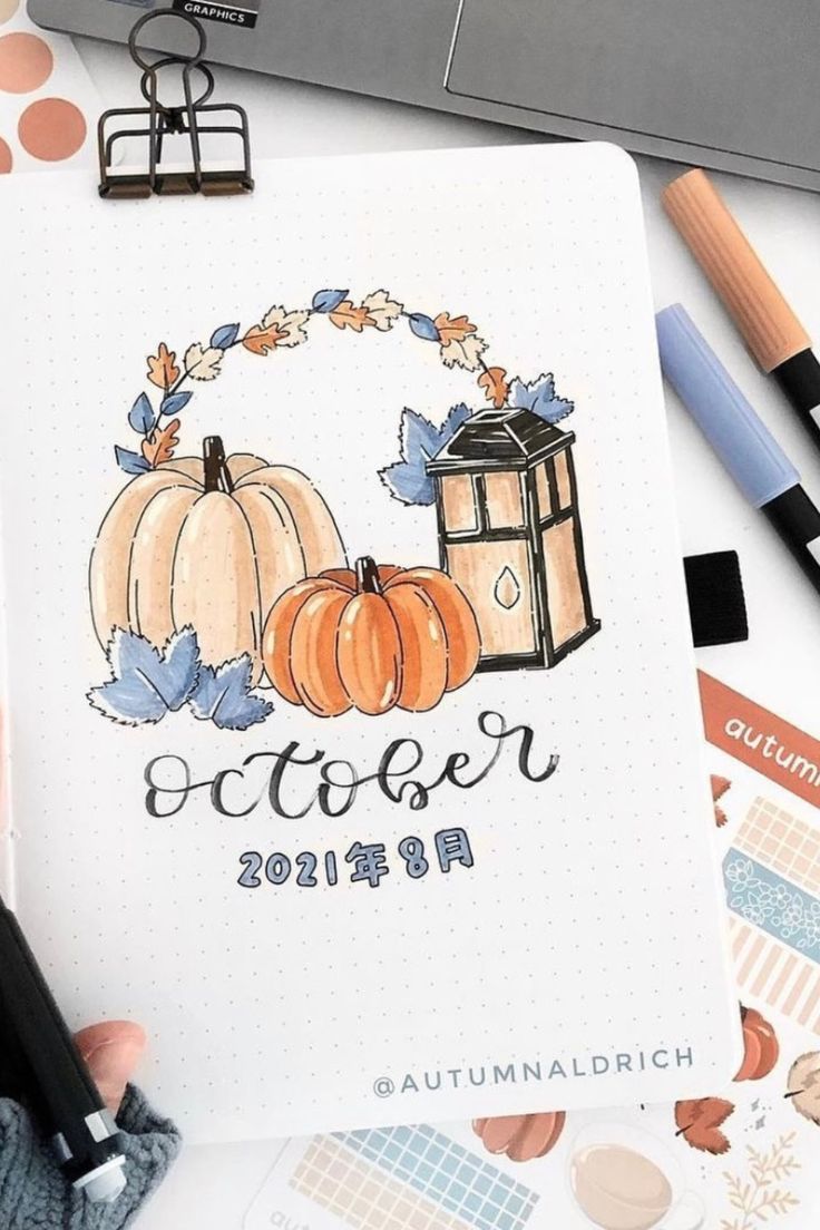 a person is holding a pen and looking at a paper with the words october written on it