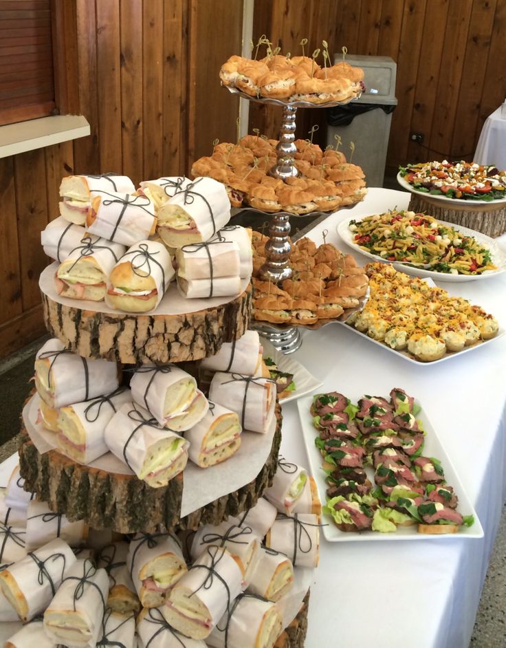 a table topped with lots of different types of desserts and pastries on top of it