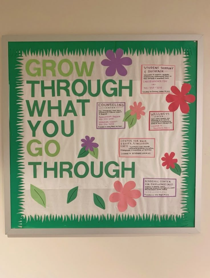 a bulletin board with flowers and words on it that says grow through what you go through