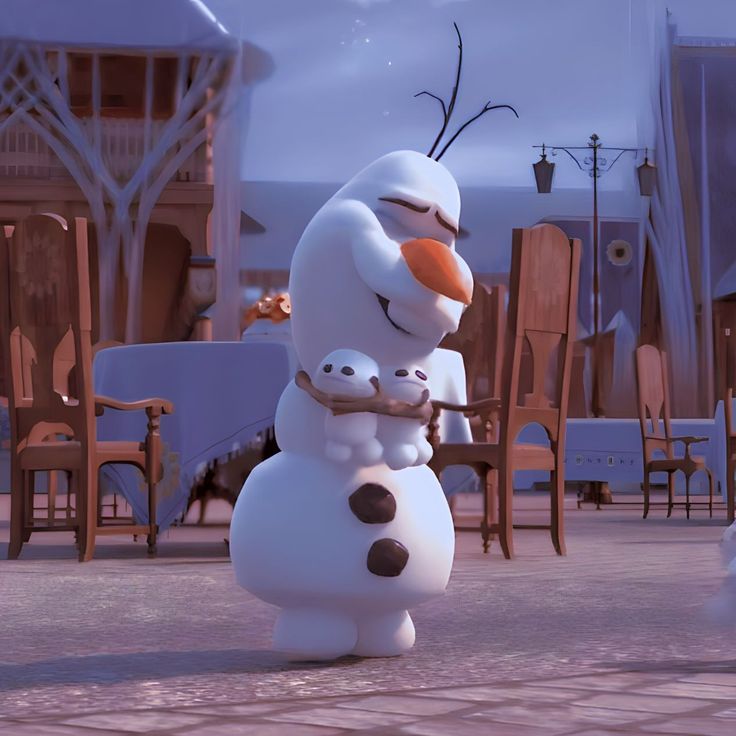 an animated snowman holding a baby in his arms