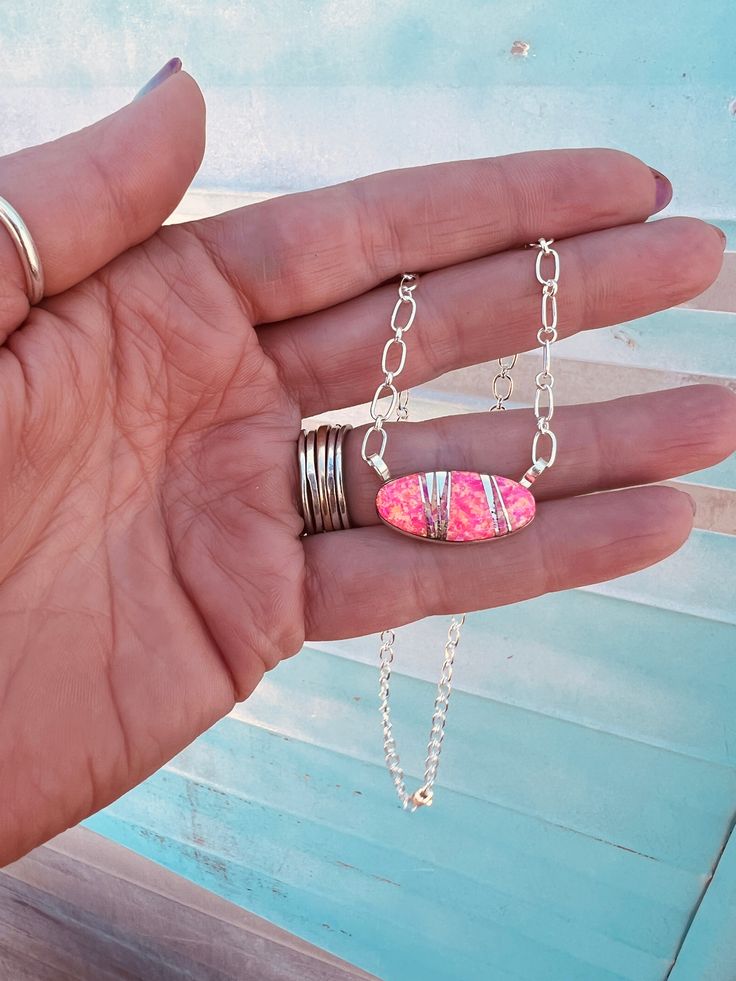 THIS! It'e one of my favorites from the Barbie line! Hot pink and soooo pretty! LOVE the inlay on this one! Created by Michelle Willie! Pink Sterling Silver Oval Pendant Jewelry, Pink Oval Sterling Silver Necklace, Pink Sterling Silver Jewelry With Oval Pendant, Pink Pendant Jewelry Gift, Pink Oval Sterling Silver Jewelry, Oval Pink Sterling Silver Jewelry, Pink Oval Jewelry Gift, Handmade Pink Pendant Necklace, Pink Oval Pendant Necklace Gift