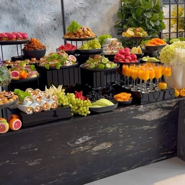 a table filled with lots of different types of fruits and veggies on it