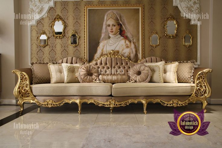 an ornate couch in front of a painting on the wall with gold trimmings