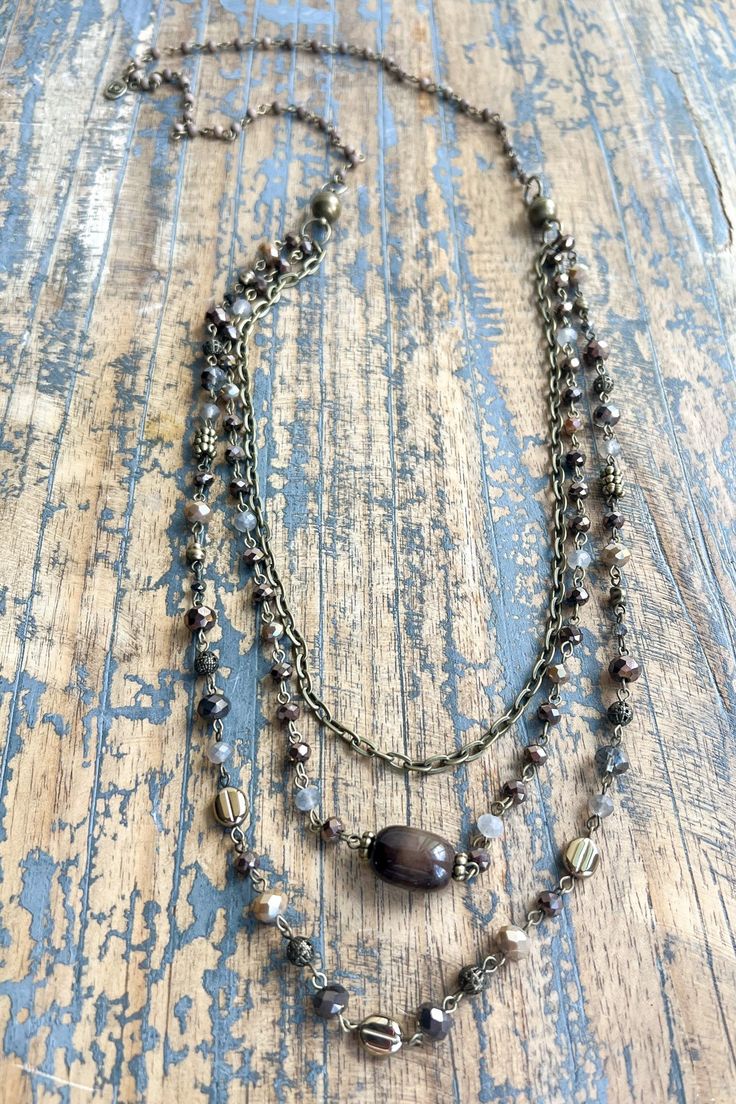 Indulge in luxury with our Medina Necklace featuring Tiger's Eye stones. This versatile, multi-functional piece can be worn in 5 different ways, thanks to the magnetic closure. With 3 layers of intricate beading, the bottom piece can be worn as a long necklace. The top piece can transform into a bracelet or choker necklace, while each piece can be worn separately or layered together for a 4-layer look. Elevate any outfit with this exclusive and stylish accessory! Intricate Beading, Diy Jewelry Projects, Pink Pineapple, Tigers Eye Necklace, Stone Beaded Necklace, Next Clothes, Tiger Eye Stone, Tiger's Eye, Eye Necklace