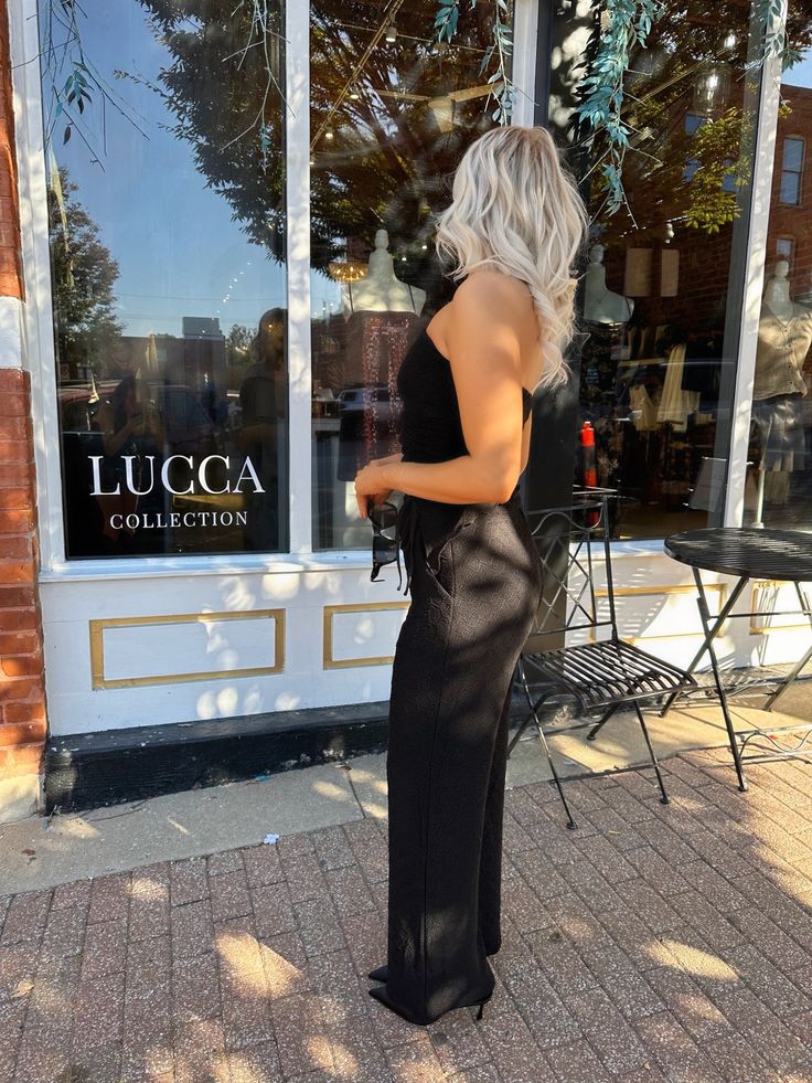 Step out in style with the Veda Set, an effortlessly chic black two-piece ensemble that redefines elegance. This stunning set features a strapless full-length top that beautifully accentuates your shoulders, making it a perfect choice for any occasion. The high-waisted, wide-leg pants create a striking silhouette, elongating your legs and providing a comfortable fit that flatters all body types. Style Recommendations:- Pair with strappy heels and bold jewelry for a glamorous evening look!- Layer Glamorous Strapless Jumpsuit For Spring Evening, Glamorous Spring Evening Strapless Jumpsuit, Elegant Strapless Stretch Jumpsuit For Night Out, Elegant High-waist Strapless Jumpsuit For Spring, Sleek Strapless Jumpsuit For Evening, Elegant High Waist Strapless Jumpsuit For Spring, Chic Fitted Strapless Jumpsuit For Evening, Chic Strapless Jumpsuit For Night Out, Elegant Spring Strapless Stretch Jumpsuit