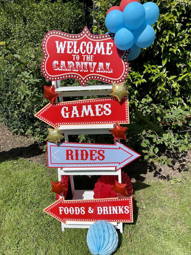 a sign that says welcome to the carnival games rides foods and drinks with balloons in the background