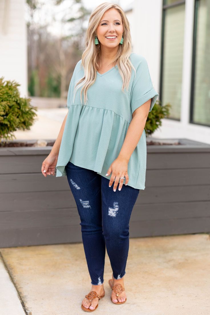 Expect many wide-eyed gazes when you're wearing this top! This top has a sleek design with a pretty aloe color you can dress up or down and style for every occasion! It's comfortable for all day wear, has a figure-flattering baby doll fit, and features the cutest cuffed-sleeves for the ultimate trendy look! Simply, style this top with skinnies and booties for an easy everyday outfit! 100% Polyester Everyday Outfit, Model Fits, Cuff Sleeves, Baby Doll, Everyday Outfits, Sleek Design, The Cutest, Baby Dolls, Dress Up