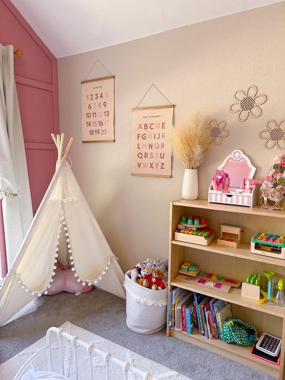 a child's room with a teepee tent, bookshelf and toys