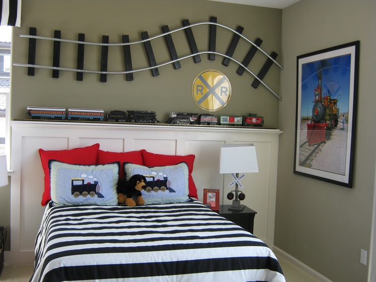 a bed room with a neatly made bed and pictures on the wall