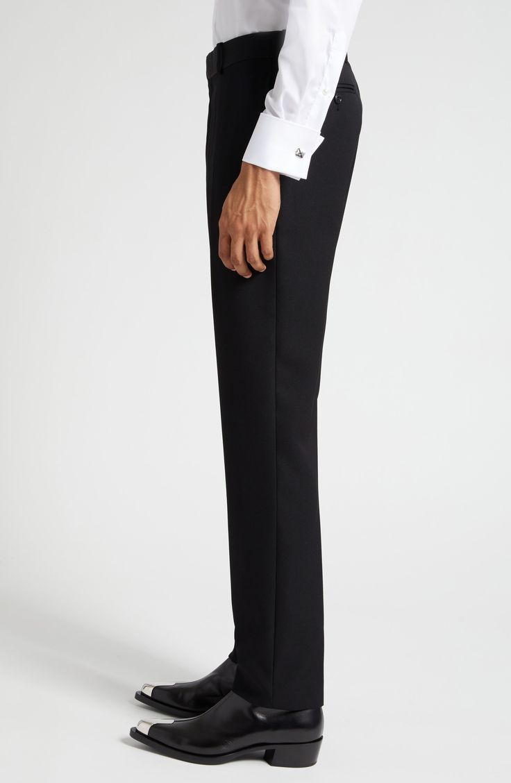 Tailored elegance pervades Italian-crafted trousers fashioned from smooth wool with cleanly pressed creases and a flat front. 34" unhemmed inseam; 14" leg opening; 11 1/2" front rise; 15 1/2" back rise (size 48 EU) Zip fly with hook-and-bar closure 100% wool Dry clean Made in Italy Men's Designer Clothing Elegant Evening Dress Pants With Structured Boning, Elegant Wool Trousers, Elegant Tailored Dress Pants, Fitted Evening Suit Trousers, Fitted Evening Suits With Trousers, Classic Flat Front Tuxedo For Formal Occasions, Classic Formal Tuxedo With Flat Front, Elegant Tailored Tuxedo With Flat Front, Classic Tuxedo With Pressed Crease And Flat Front