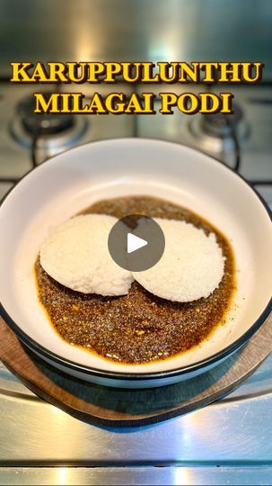 a bowl filled with food sitting on top of a stove