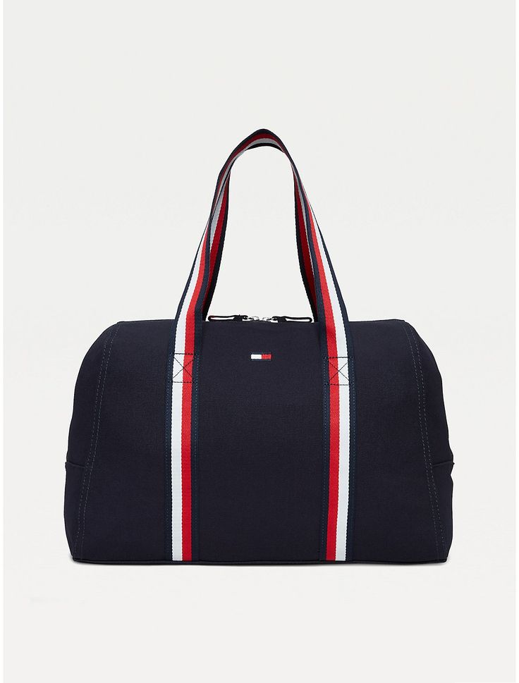 Tommy Hilfiger women's bag. Practicality and standout style come together in this spacious zip tote, showcasing our signature stripes at the handles for a branded finish.  Material: 100% Cotton. Everyday Tommy Hilfiger Bag With Zipper Closure, Tommy Hilfiger Travel Bags With Zipper Closure, Sporty Canvas Bags For On-the-go, Sporty Cotton Bags For Daily Use, Sporty Rectangular Cotton Bag, Sporty Canvas Gym Bag, Navy Sporty Bag With Zipper Closure, Sporty Navy Bag With Zipper Closure, Sporty Rectangular Canvas Bag