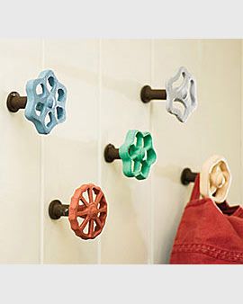 several colorful knobs are attached to the wall