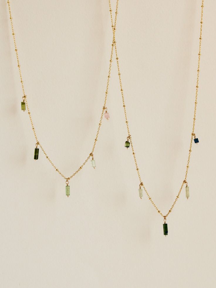 Five pieces of tourmaline, ranging from all shades of green to mauve-y pink, suspended from beaded curb chain. Lovely worn solo or stacked with a favorite necklace. Green Pendant Necklace With Beaded Chain, Green Beaded Chain Pendant Necklace, Handmade Green Tourmaline Necklaces, Green Tourmaline Gemstone Necklace, Green Gemstone Beads Necklaces, Green Gemstone Beads Dangle Necklaces, Green Gemstone Beads Dangle Necklace, Green Dangle Necklaces With Gemstone Beads, Green Dangle Necklace With Beads