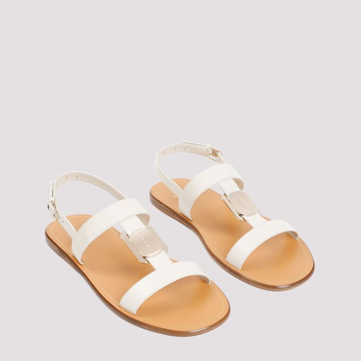 Ferragamo White Mascarpone Lamb Leather Vida Sandals. Round and open toe, front leather strap with metallic logoed tag, adjustable ankle strap. Leather Cap, Beach Tote Bags, Sneaker Heels, Mens Sandals, Leather Jewelry, Lanvin, Mens Shoes Sneakers, Shoulder Handbags, Valentino Garavani