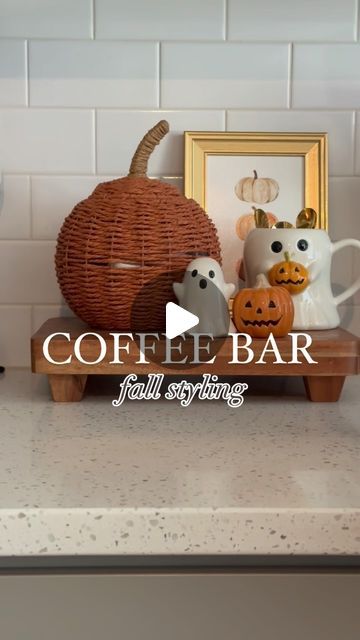 the coffee bar is decorated with pumpkins and jack - o'- lantern faces