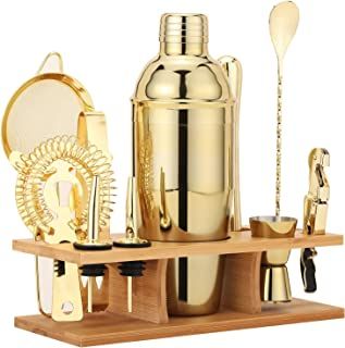 a gold cocktail set on a wooden tray