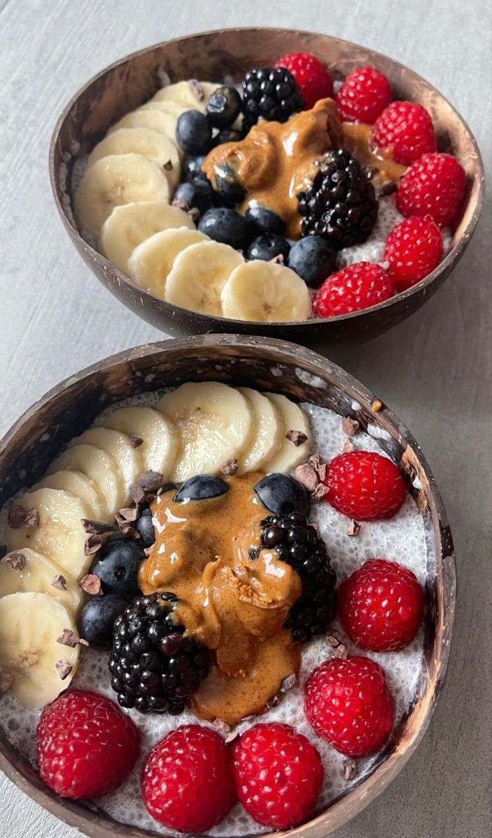 two bowls filled with different types of fruit