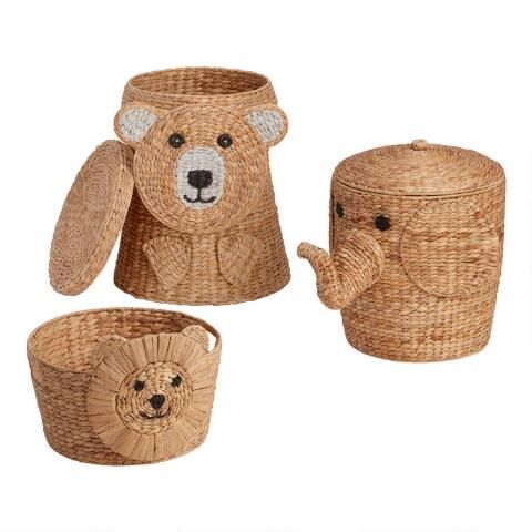 three wicker baskets with teddy bears on them and one holding a teapot in the shape of a bear