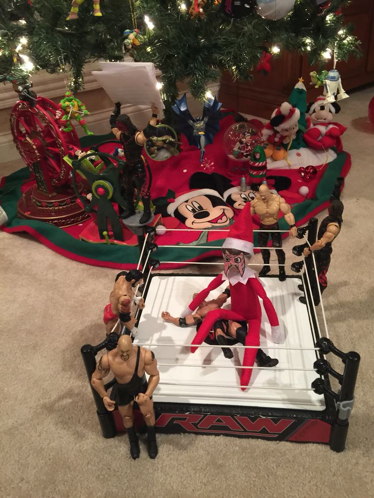 a group of toys sitting on top of a wrestling ring