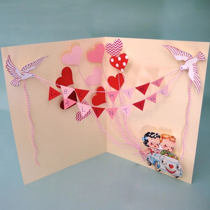 an open card with hearts and bunting on it