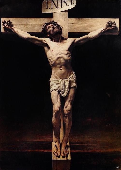 the crucifix is displayed in front of a painting